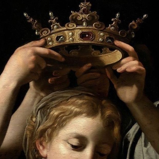 Hands lowering a jewelled golden crown onto a young head